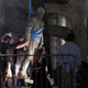 A statue of Confederate Gen. Robert E. Lee is removed from the University of Texas, Austin, campus, during the early morning of Aug. 21, 2017. (Eric Gay/AP Images)